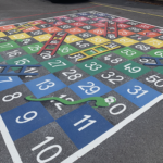 Half solid snakes and ladders on a playground
